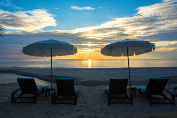 Relax on the beach canvas chair in the morning light.