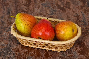 Pear heap in the wooden basket