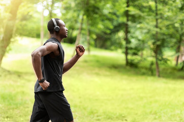 Profile photo of black jogger training at park