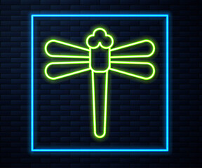 Glowing neon line Dragonfly icon isolated on brick wall background. Vector.