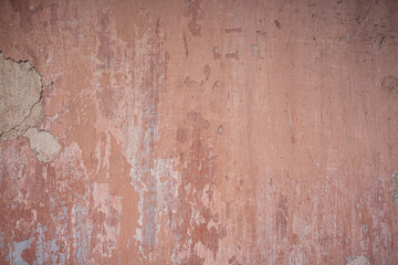 old pink wall with layers of painting