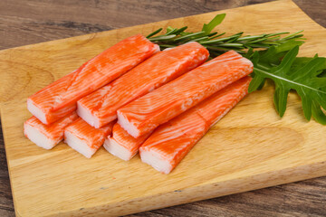 Crab stick surimi over board