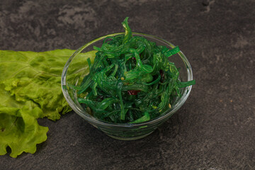 Green Chuka Seaweed Salad Isolated on White Background Top View. Wakame Sea Kelp Salat
