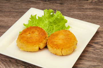 Vegan cuisine - Potato cutlet in the plate