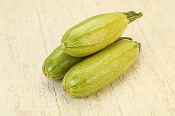 Young tasty zucchini over board