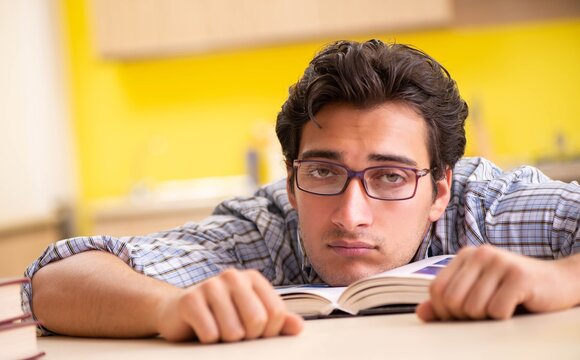 Student preparing for exam sitting at the kitchen