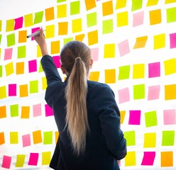 Beautiful female employee with many conflicting priorities