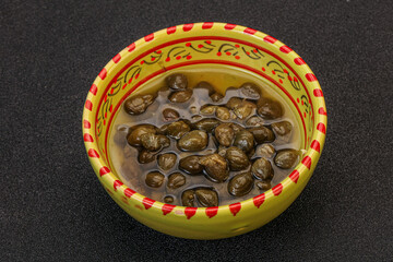 Tasty capers in the bowl