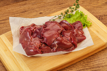 Raw chicken liver over board