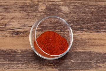Dry paprika powder in the bowl