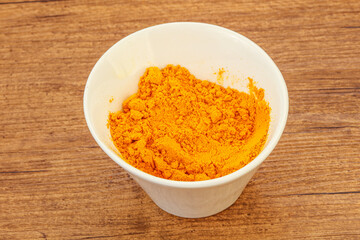 Tumeric powder in the bowl