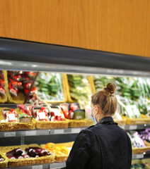 Supermarket shopping, face mask and gloves,woman buying vegetables at the market	