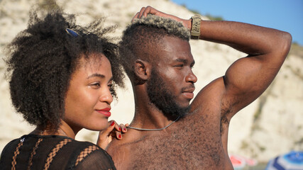 Portrait of african american couple standing outdoors along the beach
