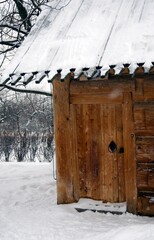 Wooden house in the snow