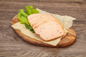 Boiled pork sausage over board