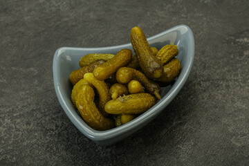 Pickled gherkin in the bowl