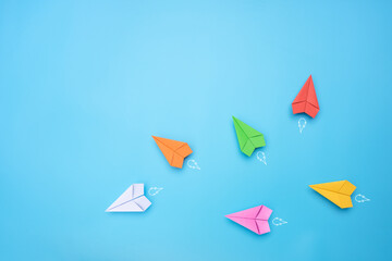 Group of paper planes individual pointing in the different way. Business for Innovative solution...