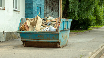 blue tank with construction debris