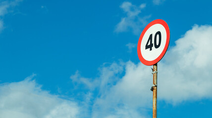 road sign speed limit on a blue sky background