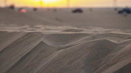 Closeup shot of a sand dune during sunset