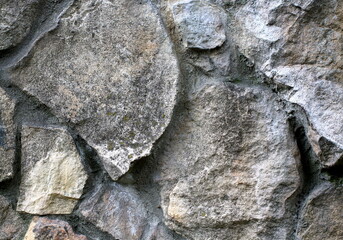 Texture of old natural stones stone wall