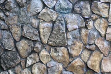 Texture of old natural stones stone wall