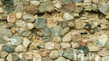 Wall of oval stones, backgrounds, textures