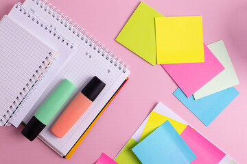 colorful office stationary supplies on pink
