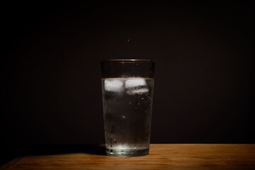 Old soda, glass and ice