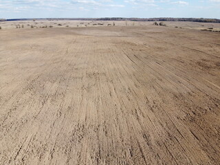 Plowed agricultural field, aerial view. Farmland. Landscape.