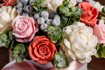 Bouquet of beautiful bright rose flowers in a gift cylindrical cardboard box
