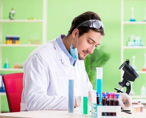 Man chemist working in the lab