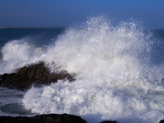 sea waves hitting rocks