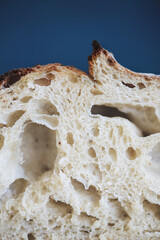 Baked bread of sourdough. Bread crust. Close up. The bread of sourdough, homemade and natural creation. The sourdough has natural yeast, which makes the food healthier, as well as rich.