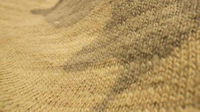 Macro close up over camo patterned clothing material