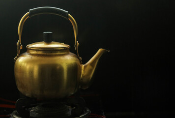 a traditional Arabian golden kettle from a antique collection.