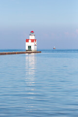 Fototapeta na wymiar Kewaunee Pierhead Lighthouse in Kewaunee, Wisconsin on lake Michigan in July