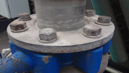 large metal pipe flanges bolted together
