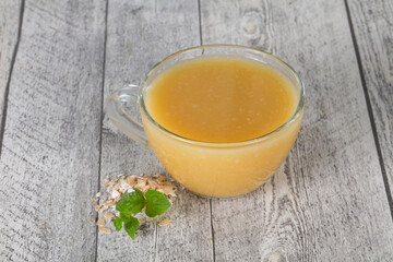 Dietary vegetarian oats milk over wooden