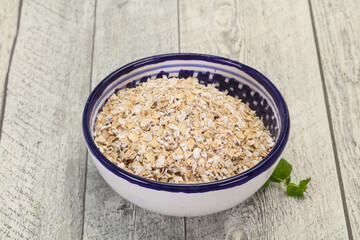 Raw oats in the bowl