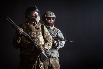 American special forces, two soldiers in military uniform with weapons on a dark background, elite...