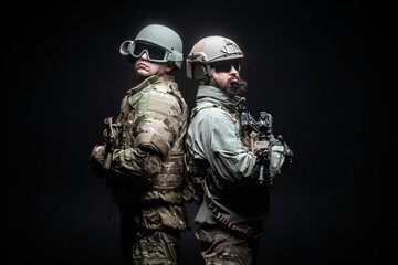 American special forces, two soldiers in military uniform with weapons on a dark background, elite...