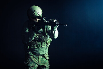 special forces attack, soldier in uniform with a rifle in action, american ranger with guns