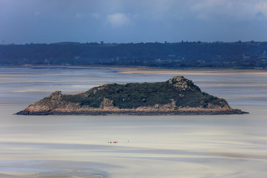 Tidal Island Tombelaine and mudflats in the bay of Mont Saint-Michel