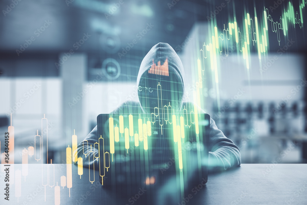 Aufkleber Unrecognizable hacker using laptop with stock chart and  business statistics hologram.