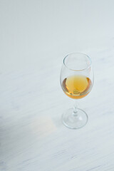 Glasses with white wine staying on the wight background