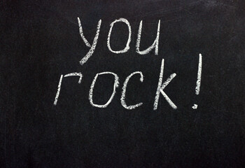 
The inscription on the dark board is "you rock!". Motivating phrase