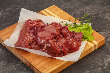 Raw chicken liver over board
