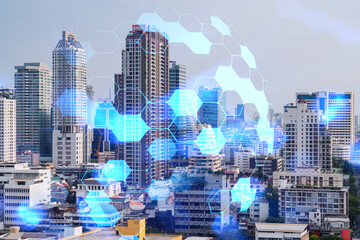 Abstract technology icons hologram over panorama city view of Bangkok, Asia. The concept of people networking and connections. Double exposure.