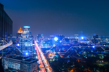 Information flow hologram, night panorama city view of Bangkok. The largest technological center in...